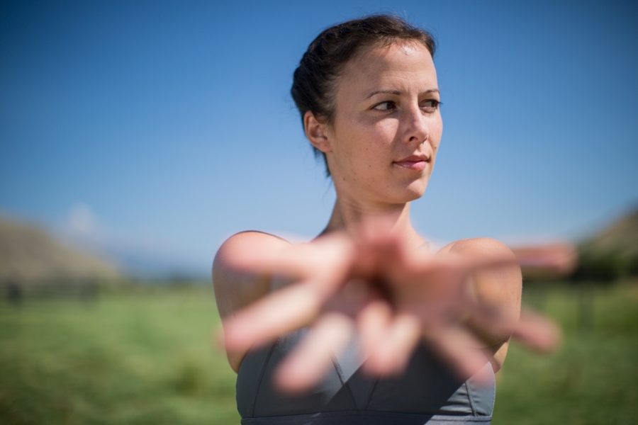 woman extends her hands in a yoga mudra -yogatoday