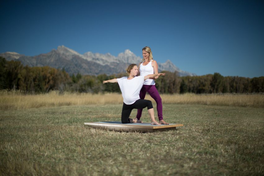 pregnant woman practices yoga