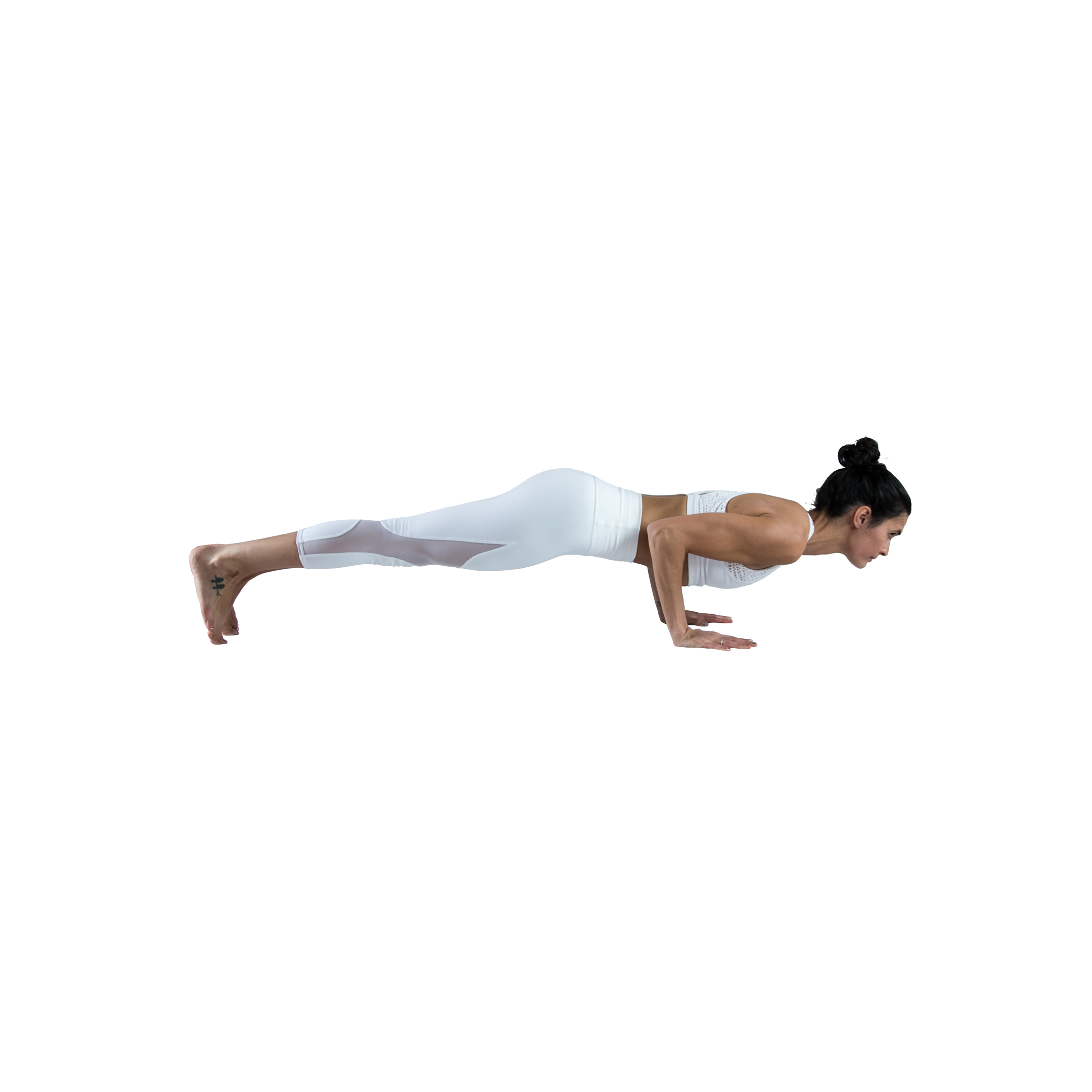 woman practices low plank pose