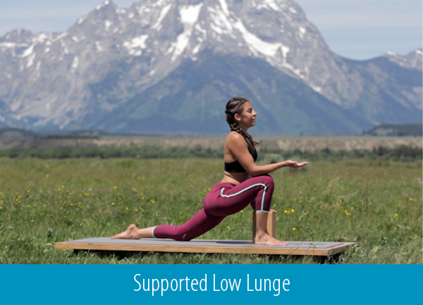 cyclist practices low lunge pose during a yoga class outdoors - yogatoday