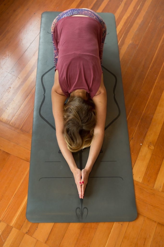 woman practices child's pose