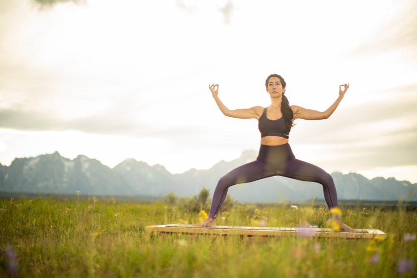 woman practices yoga in Grand Teton National Park